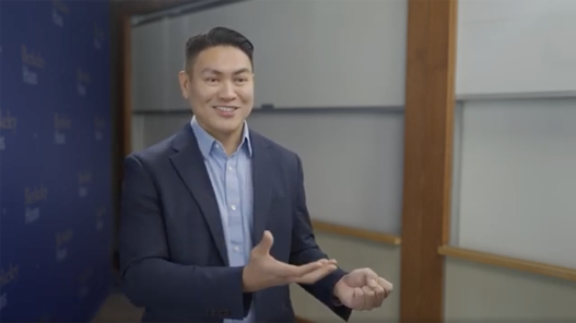Doy Charnsupharindr smiling while talking