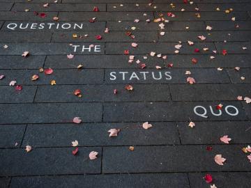 Question the Status Quo engraved on the floor