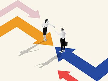 Two people dressed in professional attire face each other with their hands outstretched for a handshake, standing on top of arrows pointing toward each other