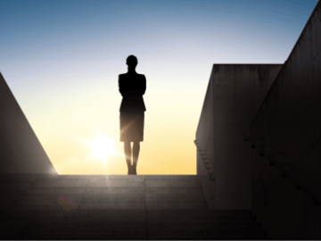silhouette of a women standing on top of a staircase