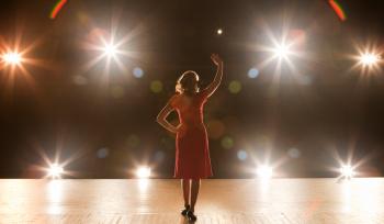 woman standing on stage