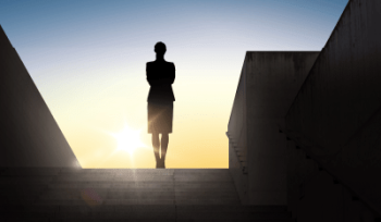 silhouette of a women standing on top of a staircase